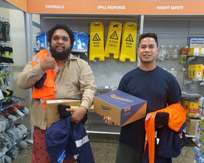 Vili and Clendon buying safety gear.